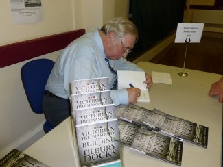 Richard Burrell signing copies of the book | Annie O'Brien