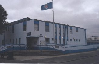 Tilbury Police Station at dusk.